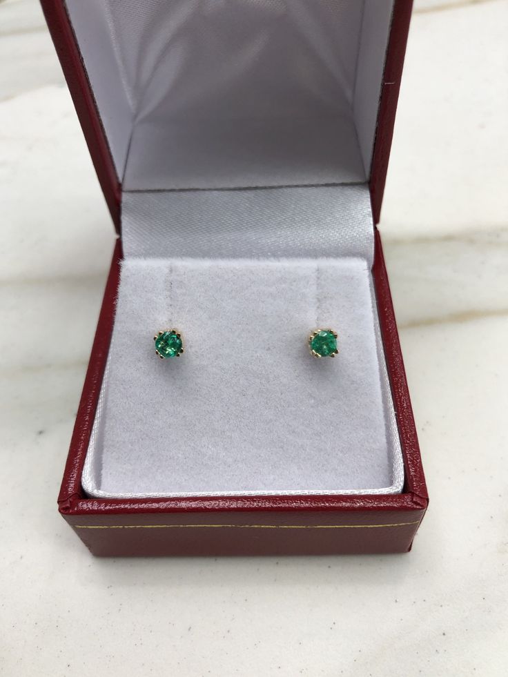 AAA+ fine quality Colombian emerald studs set in 14K yellow gold. vivid-green emeralds with incredible transparency, accented by a simple double-prong 14k yellow gold mount, allowing for the emerald to be shown in full view. The earth mined, green Colombian emeralds have a desirable lush green color with excellent qualities. These earrings are ideal for everyday use and are the perfect accessory to any outfit. Total Carat Weight: 0.24tcw Setting Style: Double Prong Setting Material: 14K Yellow, Round Earrings With Prong Setting For May Birthstone, May Birthstone Earrings With Prong Setting In Round Cut, May Birthstone Round Cut Earrings With Prong Setting, May Birthstone Earrings With Prong Setting, Classic Round Earrings For May Birthstone, Classic Round May Birthstone Earrings, Yellow Gold Earrings For May Birthstone, Fine Jewelry Earrings For May Birthstone, Classic Round Diamond Earrings For May Birthstone