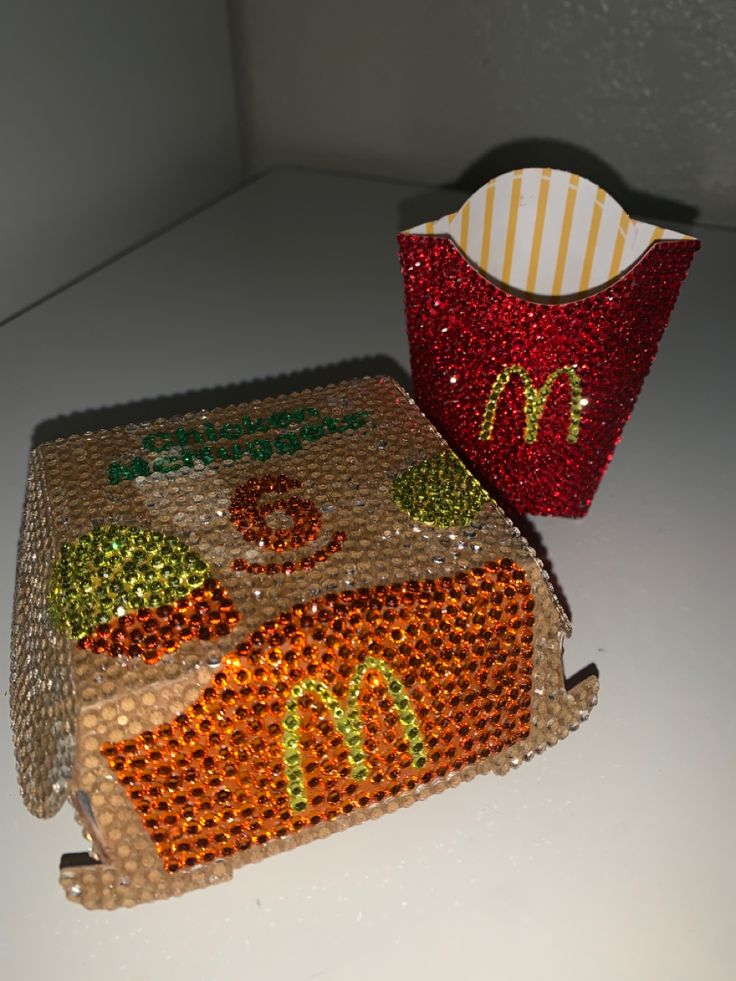 a mcdonald's bag next to a cup on a table