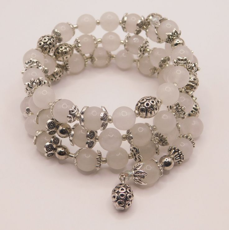 Created with and  White Jade Gemstone 8mm beads combined with silver plated metal beads and bead caps on memory wire. Beaded Bracelet Ideas, 8mm Beads, Wire Bracelets, Coral Bracelet, Jade Gemstone, Memory Wire Bracelet, Memory Wire Bracelets, White Jade, Bracelet Gemstone