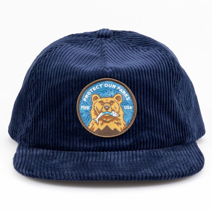 Take your look to the next level with our Protect Our Parks Bear Corduroy Cap. Crafted from premium 8 wale corduroy with an adjustable plastic clipback, this vintage inspired hat is made for durability and comfort, with recycled materials and an athletic soft sweatband. Add some vintage style to your wardrobe now! 8 wale corduroy Fabric: 100% Cotton Shape/ Profile: Lower Profile Closure: Clipback for maximum comfort Bill Shape: Flat Bill Bill made from recycled materials Coolmax athletic sweatba Adjustable Blue Corduroy Hat, Outdoor Corduroy Snapback Baseball Cap, Corduroy Snapback Baseball Cap For Outdoor, Outdoor Corduroy Baseball Cap With Curved Brim, Casual Corduroy Hats For Outdoor, Adjustable Corduroy Hats For Outdoor, Adjustable Corduroy Snapback Hat With Curved Brim, Corduroy Baseball Cap With Flat Bill For Outdoor, Vintage Adjustable Corduroy Trucker Hat