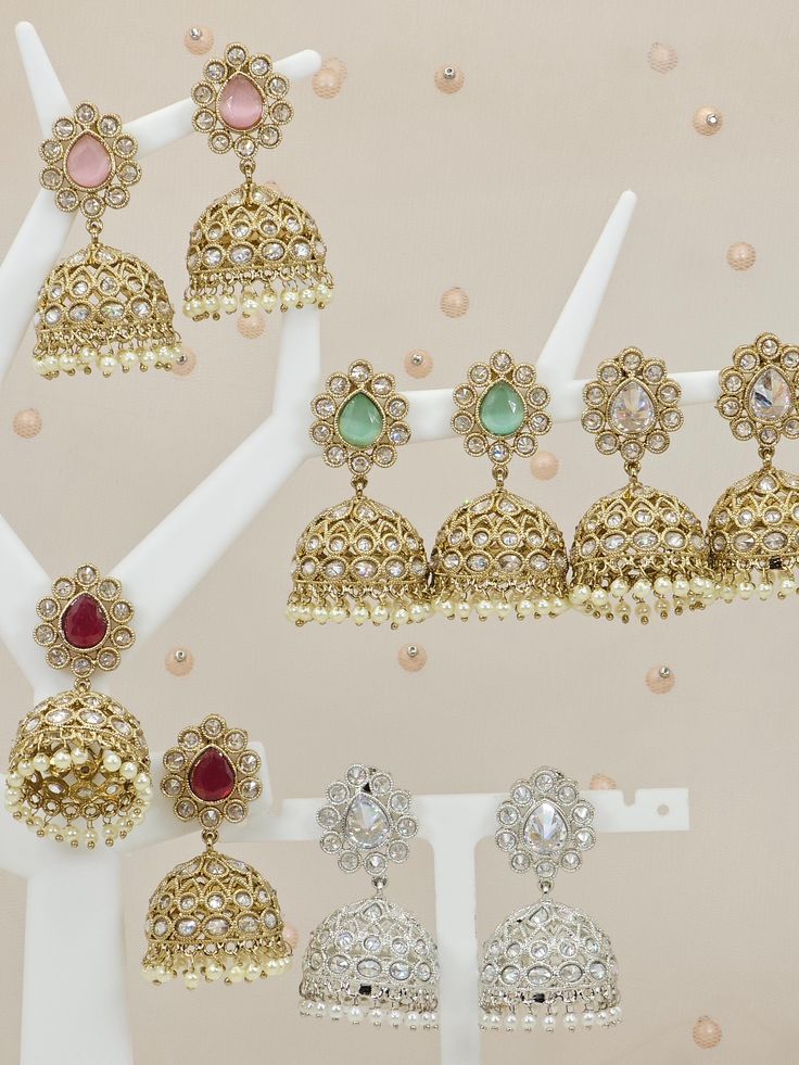 Elegant lightweight Antique Gold Polki & Pearls Earrings to wear with your beautiful outfit and shine like a star. Choose from colors: Golden, Ruby, Silver, Pink and Mint. Dimension: 2 inch Wieght: 13g each All our Jewelry pieces are delicately hand-made by artisan and can be different from pictures in color and details. Available in four colors. Please take extra care in use and storage. Bollywood Style Bridal Earrings With Stone Work For Navratri, Festive Bridal Earrings With Cutdana, Kundan Danglers For Eid Party, Festive Bollywood Jhumkas With Stone Work, Bollywood Style Festive Jhumkas With Stone Work, Bollywood Style Stone Work Jhumkas For Festive Season, Festive Bollywood Chandbalis With Stone Work, Festive Bridal Earrings With Cutdana For Celebration, Festive Bridal Cutdana Earrings For Celebrations