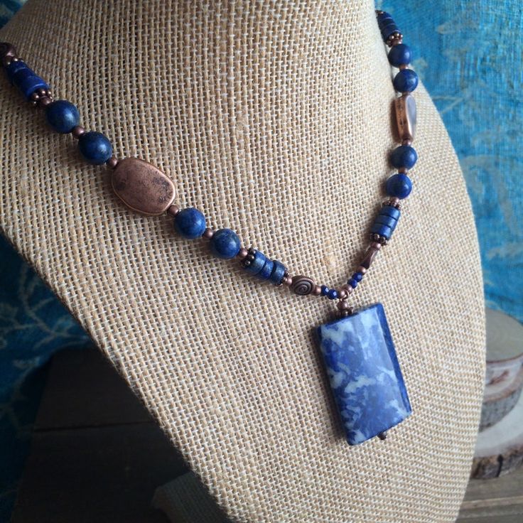 Lapis necklace set blue gemstone pendant jewelry set earrings copper lapis lazuli beaded set gift boho handmade unique jewelry for women 20 Necklace: 20 inches Earrings: 40mm Lapis lazuli is an ancient and sought after semi precious gemstone. It's the universal stone of wisdom and truth and Has been used for centuries by royalty. Commonly mined in Afghanistan, this batch comes from my home state California in San Bernardino. This beauty has a truly organic rectangle cut shape of Lapis Lazuli, wi Blue Gemstone Jewelry In Copper, Blue Gemstone Copper Jewelry, Blue Beaded Copper Jewelry, Handmade Blue Sodalite Necklaces, Blue Copper Gemstone Jewelry, Handmade Sodalite Round Bead Necklaces, Handmade Sodalite Round Beads Necklace, Blue Sodalite Jewelry With Natural Stones, Blue Sodalite Jewelry