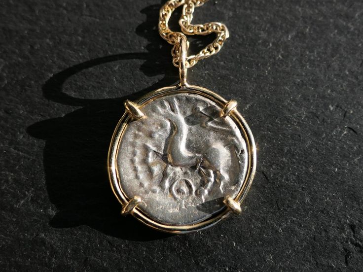 Authentic Celtic silver coin pendant, set in a hand crafted 14k gold setting. An awesome gift for a special person, coin collectors or also to keep for yourself. Dainty pendant you can wear on an everyday basis or for a special occasion. > overall pendant hanging length is 24mm (0.94 inches) including the bail > authentic silver coin from 1st century BC > minimalist 14k yellow gold setting > gold plated double rope chain in the length of your choice This coin was minted in Central Gaul (nowadays Coin Jewellery, Ancient Coin Jewelry, Ancient Coin, 1st Century, Dainty Pendant, Unique Gifts For Women, Yellow Gold Setting, Ancient Coins, Coin Jewelry