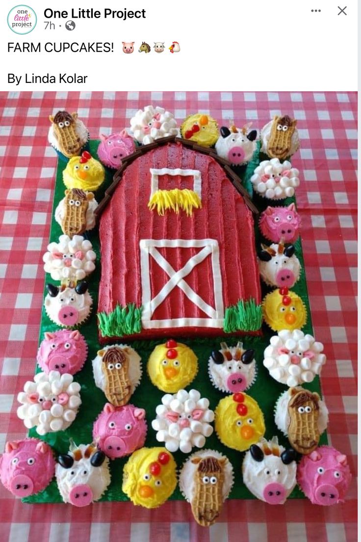 a cake made to look like a barn and farm animals