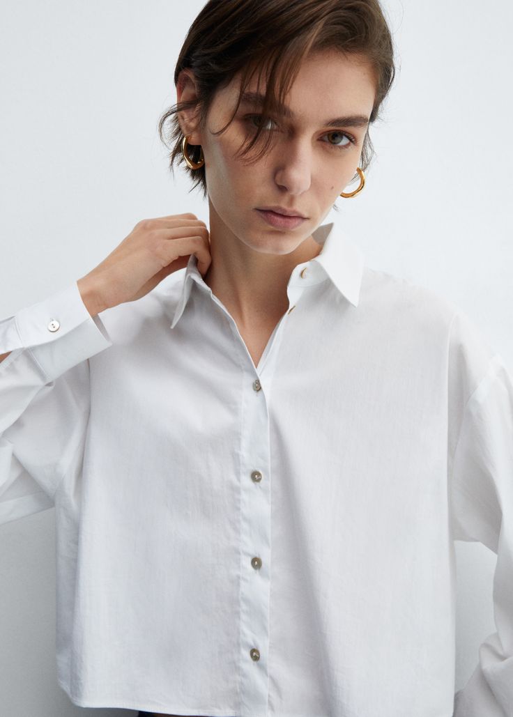 Cropped cotton shirt - Woman | MANGO USA Modern Office Shirt With Button Closure, Modern Collared Blouse With Buttons, Workwear Shirt With Collar And Covered Buttons, Long Sleeve Cotton Tops With Covered Buttons, Cotton Long Sleeve Tops With Covered Buttons, Chic Shirt With Covered Buttons For Daywear, Chic Daywear Shirt With Covered Buttons, Cotton Blouse With Buttons For Office, Everyday Blouse With Spread Collar