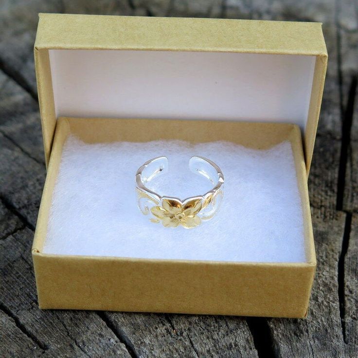 Hawaiian 925 Silver Scrolling Cut Out Toe Ring 7mm Yellow Gold Plated All toe ring comes with a gift box. Weight: 1.3g Width: 7mm Thickness: 1.25mm Quantity: 1 Toe Ring Gold Sterling Silver Flower Ring Gift, Dainty Sterling Silver Toe Rings For Gift, Dainty Sterling Silver Toe Rings As Gift, Hypoallergenic Open Band Ring As Gift, Sterling Silver Stackable Toe Rings As Gift, Gift Sterling Silver Stackable Toe Rings, Gift Stackable Sterling Silver Toe Rings, Elegant Open Band Toe Rings For Gifts, Elegant Open Band Toe Rings As A Gift