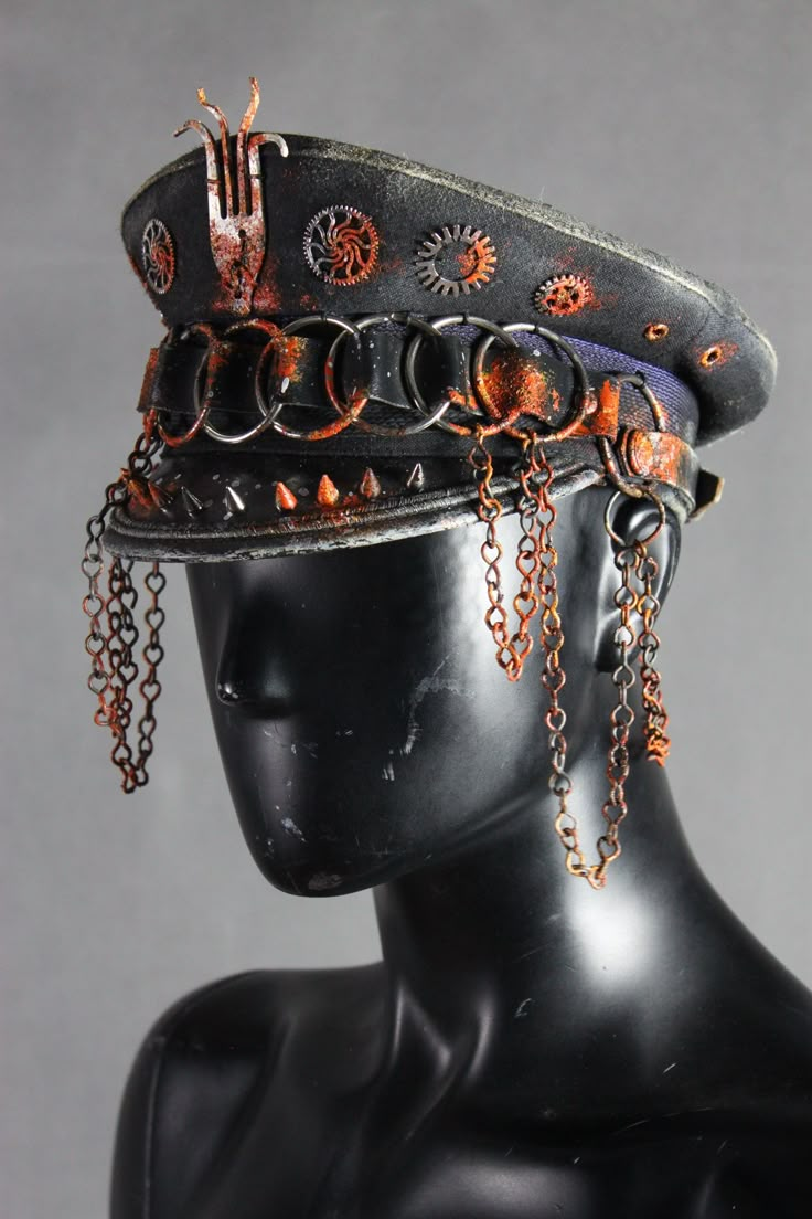 "Post Apocalyptic Hat - Wasteland Army Cap - Officer Hat - Rusty Black Hat - Chains And Studs - O-Rings Hat - Rusted Headpiece - LARP Headwear The creator of the project is Viola Sychowska, founder of 'Wasted Couture' collective. A unique black officer's hat, decorated with various metal elements - some studs, chains, o-rings, cogs and a mysterious tentacle decor which is in fact... a fork! It has an intricate rust effect applied for a sharp, post-apocalptic look. Matching pauldron: https://www. Fantasy Hat Design, Wojskowy Humor, Cool Hat, Army Hat, Army Cap, Burning Man Outfits, Steampunk Accessories, Unique Hats, New Rock