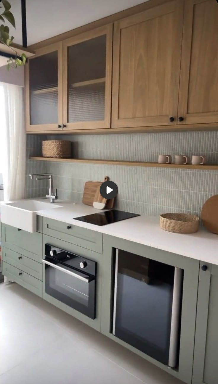 a kitchen with two ovens, sink and dishwasher on the counter top