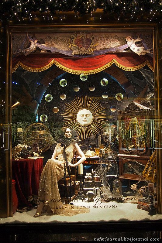 a display case with mannequins and other items in it