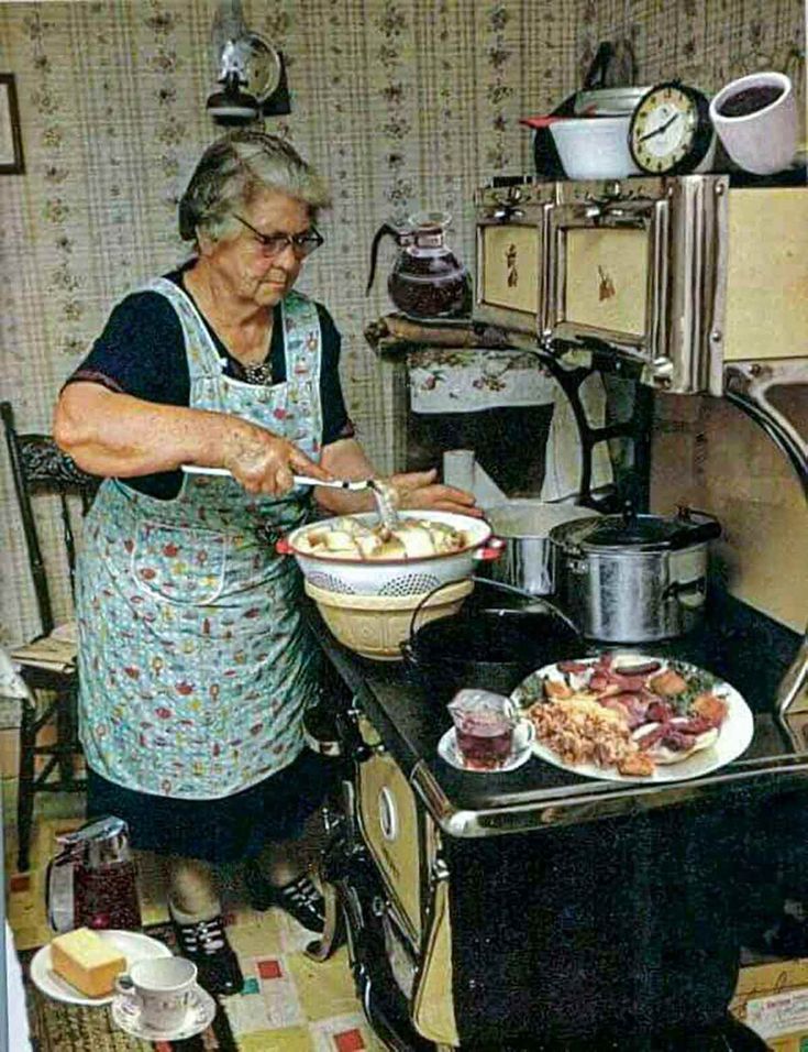 an old woman is preparing food in the kitchen