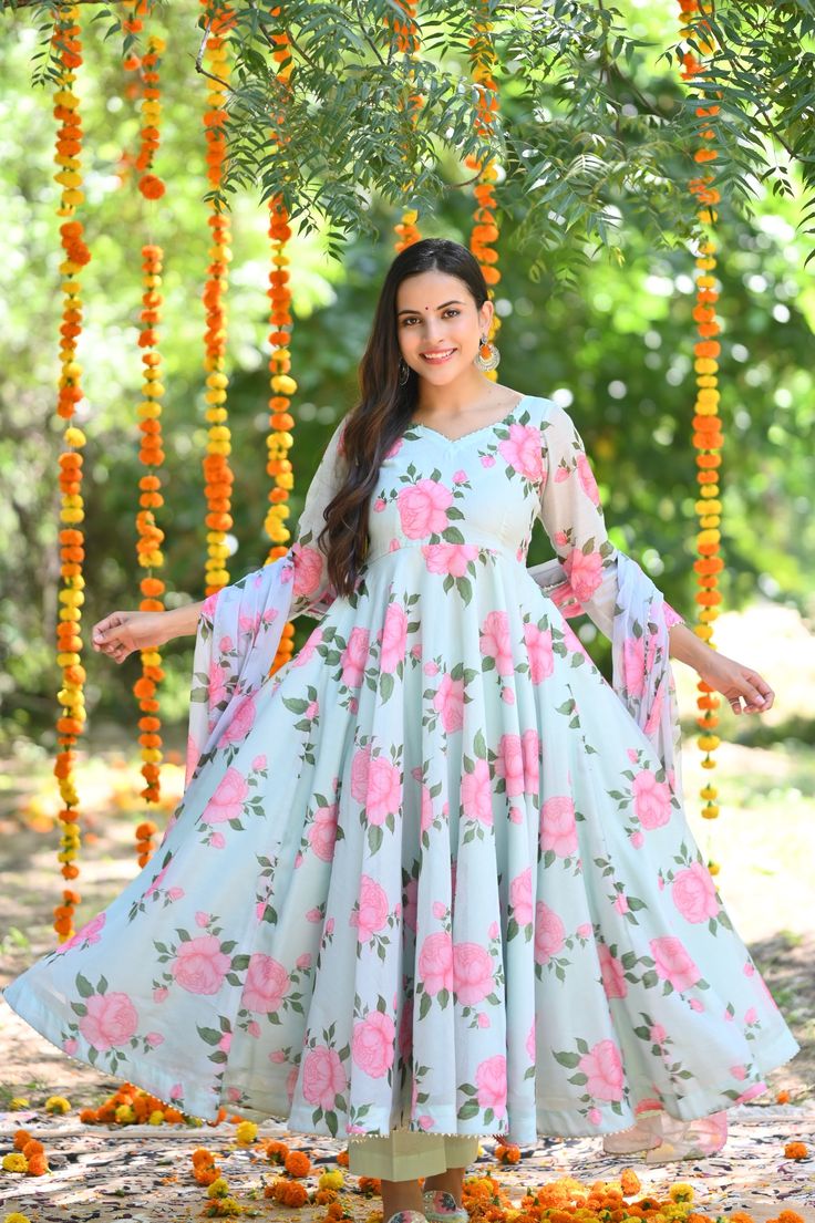 PRODUCT DESCRIPTION :-Make a statement this festive season by wearing this Brand new floral printed anarkali set.The color and the print of the outfit will make your heart BLOOM.Anarkali :- chanderi cottonPant :- CottonDupatta :- Chiffon Closure Used:- Side zipColor:-Anarkali and dupatta - Sky Pant - SkyCare Instructions :- Dry clean onlyModel Size :- Model is wearing XS sizeModel Height :- 5.6''DISCLAIMER :- Slight color variations may occur due to different screen resolution. Anarkali Style Maxi Length Dupatta With Printed Motifs, Bollywood Churidar With Printed Motifs Maxi Length, Designer Anarkali Salwar Kameez With Floral Print, Anarkali Salwar Kameez With Printed Motifs Maxi Length, Bollywood Anarkali Set With Floral Print And Long Sleeves, Bollywood Style Long Sleeve Anarkali Set With Floral Print, Designer Floral Print Kurta For Festivals, Festive Long Sleeve Floral Anarkali Set, Spring Designer Anarkali Set Floor-length