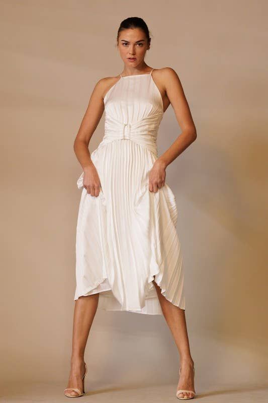 Elevate your formal attire with the Marilyn White Pleated Midi Dress. Featuring an apron neck, modern corset waist, and back tie, this plisse dress adds allure to any event. With its sophisticated design and charming details, you'll feel confident and polished. Perfect for both formal events and cocktail parties. Pleated A-line Midi Dress For Dinner, Date Night Dress With Tie Back And Fitted Bodice, Elegant Midi Dress With Folds, Elegant Midi Length Dress With Folds, Elegant Tie Back Halter Dress For Cocktail, Elegant Halter Dress With Tie Back For Cocktail, Elegant Cocktail Halter Dress With Tie Back, Spring Formal Backless Dress With Tie Back, Fitted Midi Dress With Tie Back For Dinner