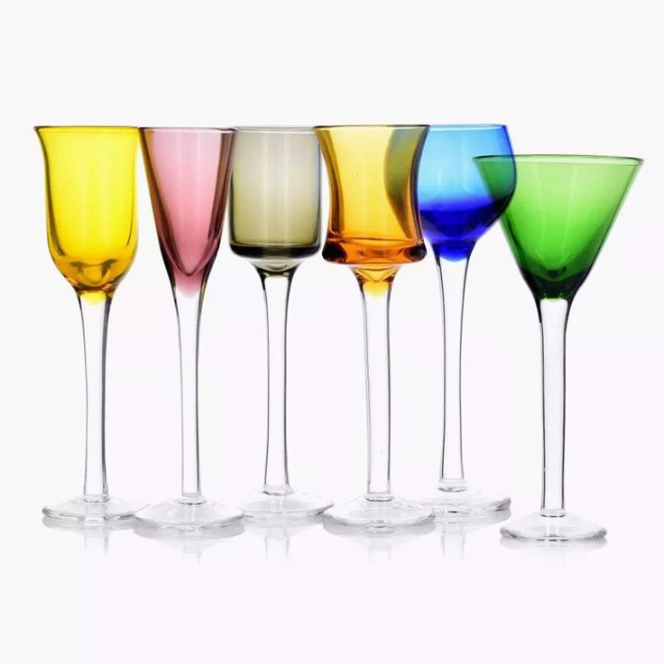 five different colored wine glasses lined up in a row