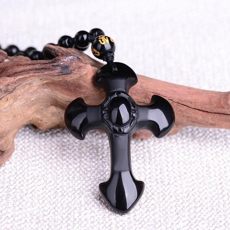 This exquisite hand-carved black obsidian pendant necklace depicts the symbol of the sacred Cross. Material: Natural Black Obsidian, Waxed Cord Chain, Beads Pendant Size: 5.2 x 3.5 cm(2.0" x 1.3") Necklace Length: Adjustable 62 to 78 cm (24.4" - 30.7") Click ADD TO CART To Order Yours Now! The Checkout Process is Guaranteed to be 100% Safe and Secure with Visa, Mastercard, AMex, Discover, Apple Pay or PayPal. Black Obsidian Necklace Gift, Black Obsidian Necklace For Gift, Black Obsidian Amulet Necklaces, Black Obsidian Amulet Necklace, Black Obsidian Necklaces For Meditation, Black Obsidian Necklace For Meditation, Black Amulet Jewelry For Meditation, Black Spiritual Necklace For Meditation, Spiritual Black Necklace For Meditation