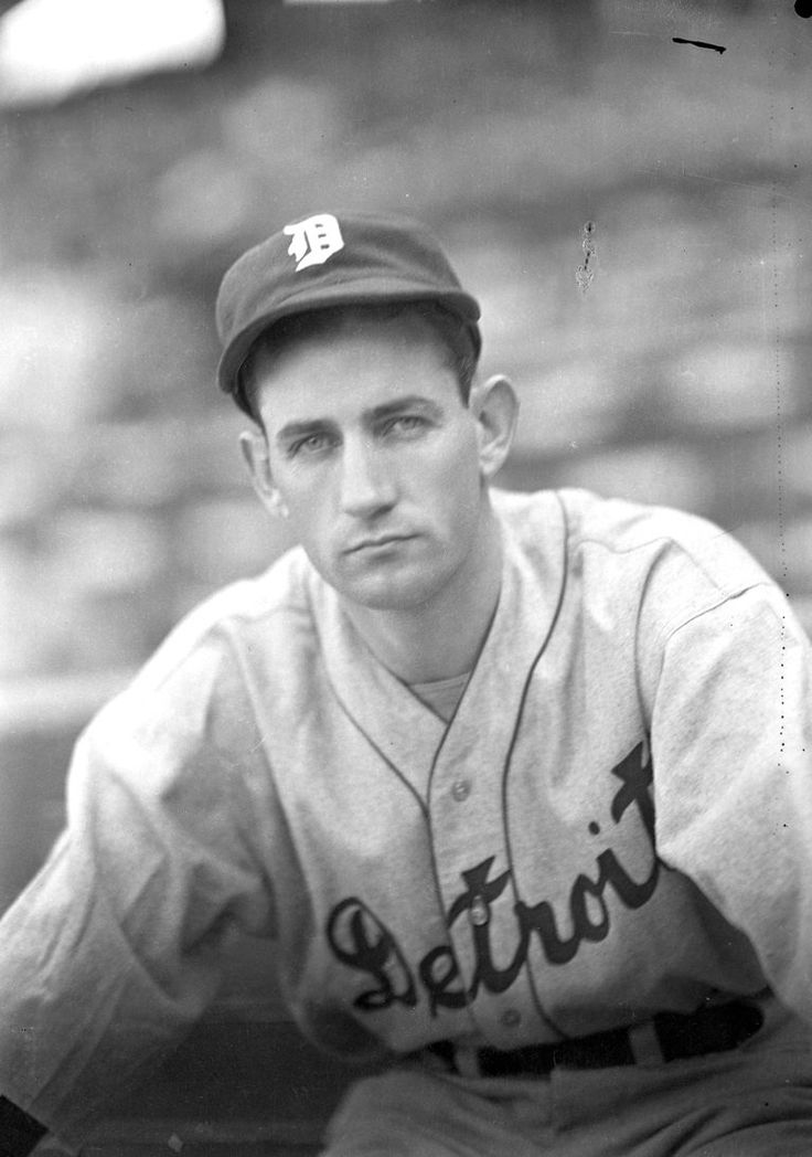 an old black and white photo of a baseball player