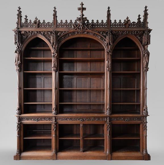 an old wooden bookcase with carvings on the front