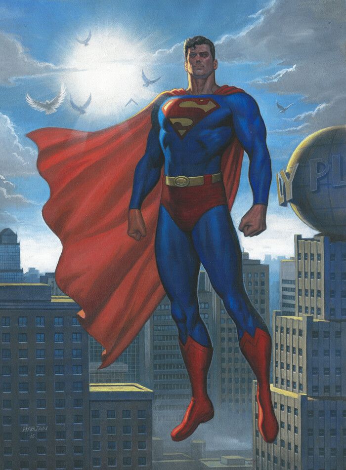 a man in a superman suit standing on top of a building