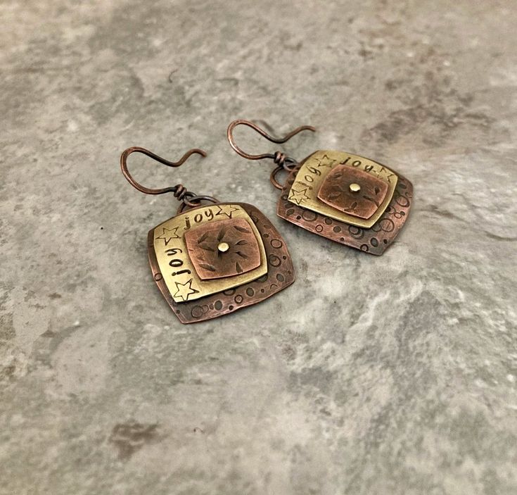 Rustic copper brass boho earrings, textured mixed metal riveted stamped square design by MetalingSusie on Etsy Riveted Jewelry, Rivet Jewelry, Cold Connections, Copper Wire Earrings, Copper Earrings Handmade, Hammered Copper Earrings, Copper Work, Metal Jewelry Making, Copper Bracelets