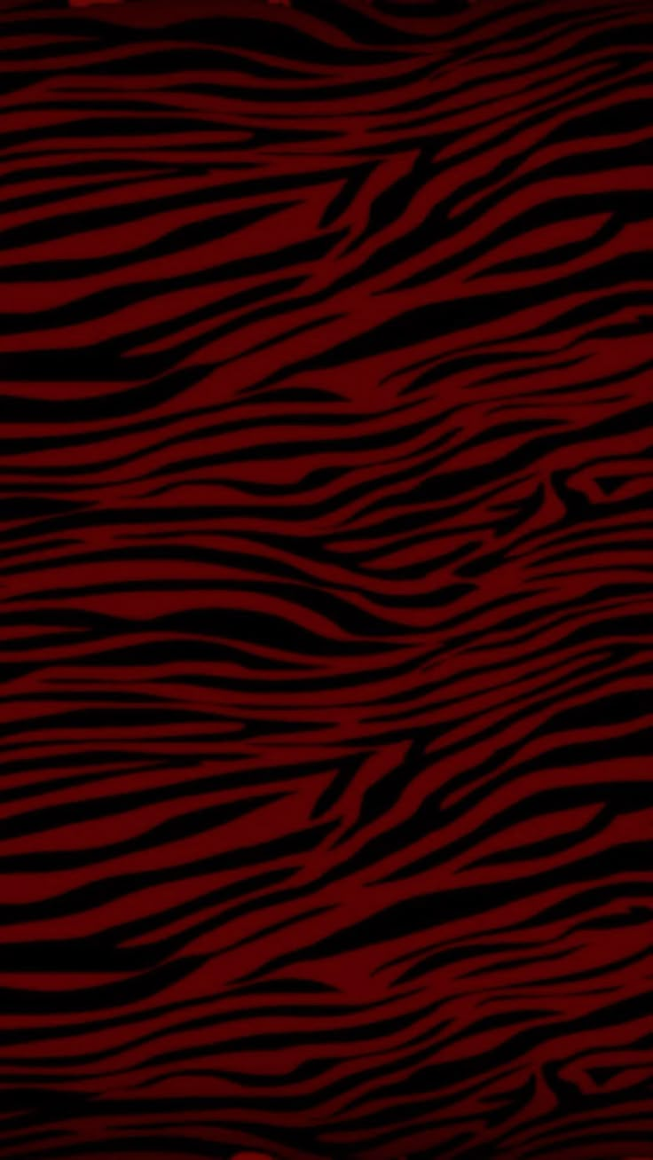 a red and black background with zebra stripes