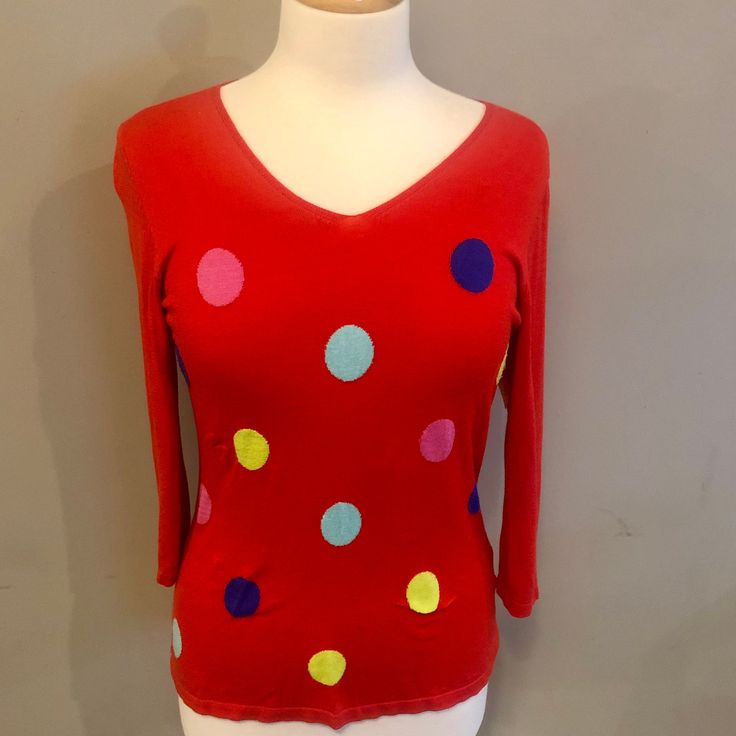 Super cute red lightweight pullover sweater, which I believe to be a silk blend, features large colourful polka dots on its front and a flattering V neck. Maker tag has been removed, but has a Talbot's vibe! In good to excellent condition; some minor pilling at front and a tiny pull, please see last two photos.  Measurements:  Shoulder to shoulder, laid flat, 16 inches Underarm to underarm, laid flat, 17 inches Length 25 inches Fun Red Tops For Fall, Playful Fitted Spring Sweater, Playful Fitted Winter Sweater, Playful Fitted Sweater For Winter, Playful Fitted Red Tops, Playful Long Sleeve Red Sweater, Playful Fitted Long Sleeve Sweater, Polka Dot Long Sleeve Top For Fall, Fitted Red V-neck Sweater