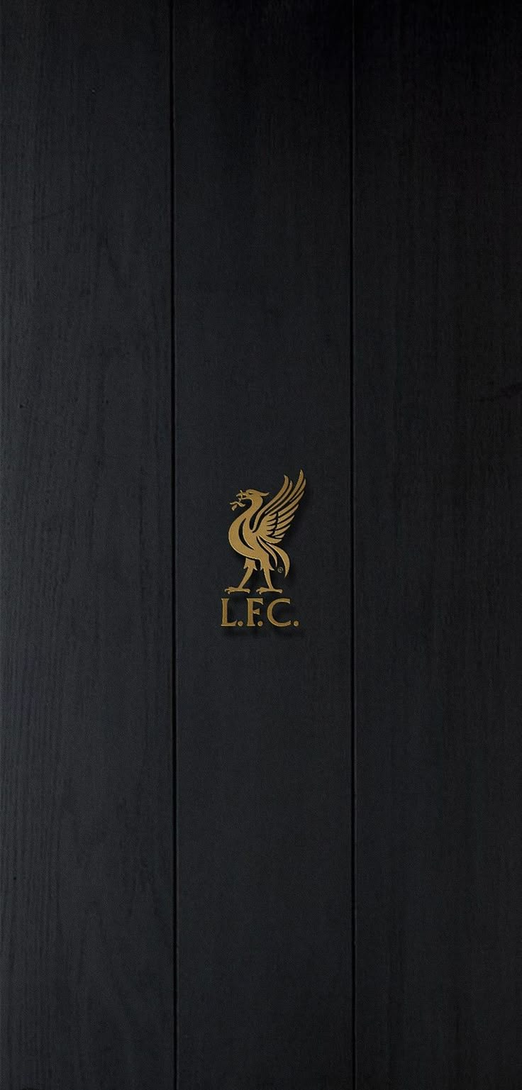 a black and gold door with the lfc logo on it