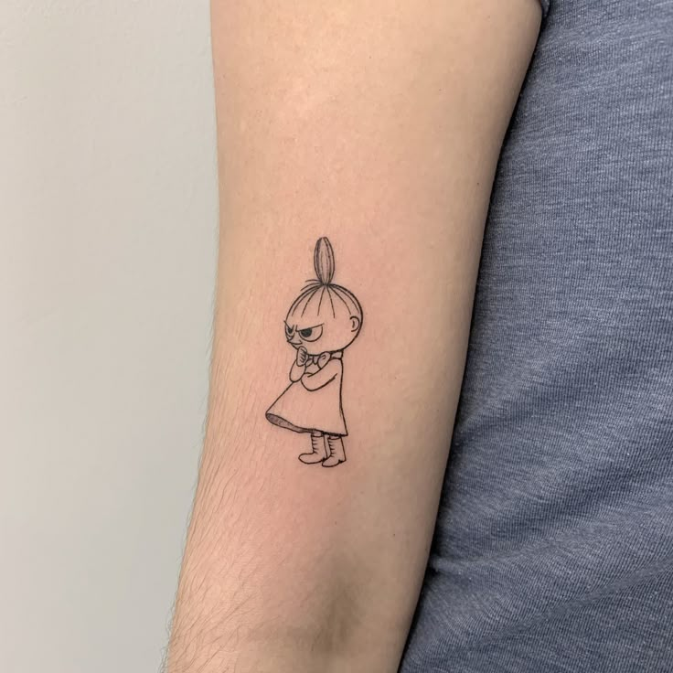 a person with a small tattoo on their arm