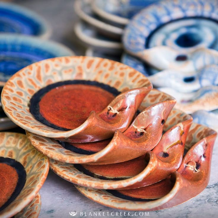 several ceramic plates stacked on top of each other