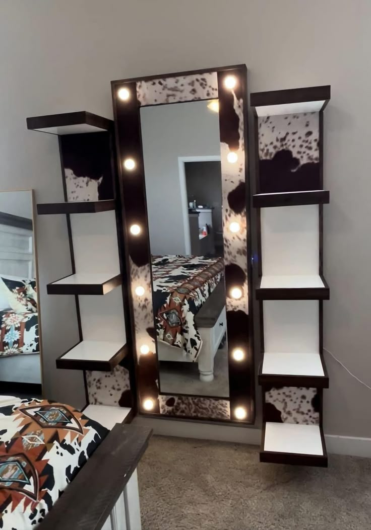 a bedroom with a mirror and lights on it