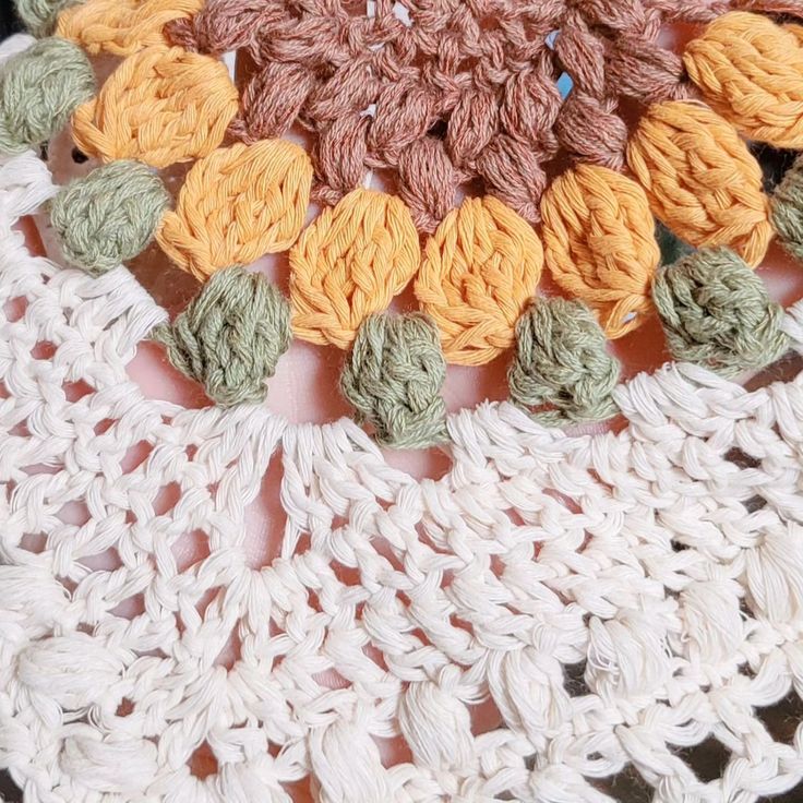 there is a crochet doily that has been placed on top of each other