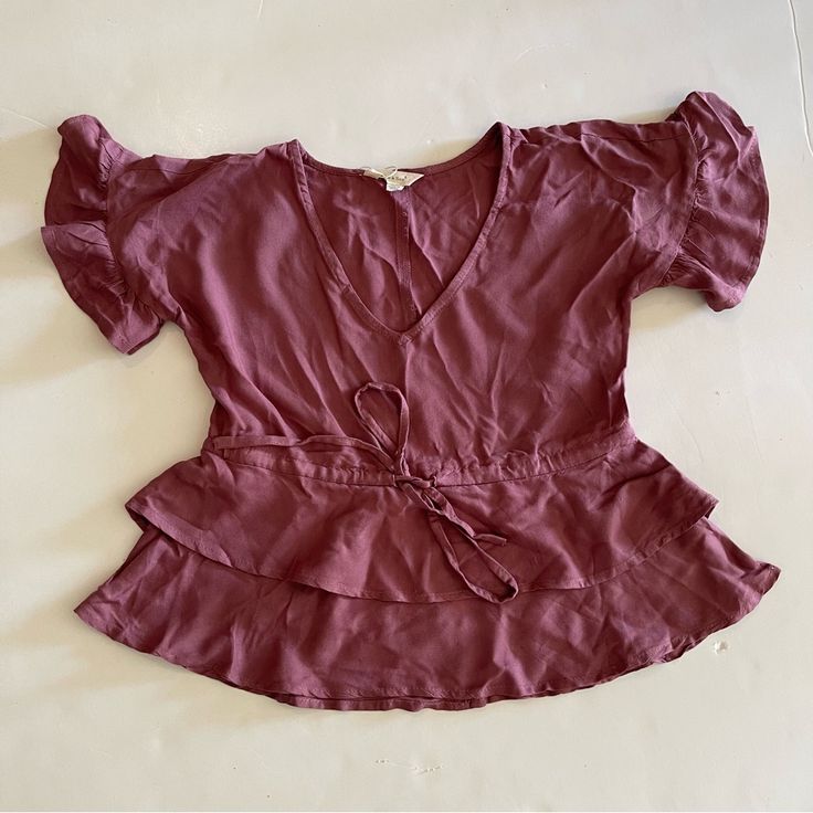 New With Tags Purple Tie-Front Ruffle Peplum V-Neck Blouse Size Xs Pit To Pit 18” Length 18” 100% Rayon Chic V-neck Top With Ruffles, Elegant V-neck Peplum Top With Ruffles, Spring V-neck Peplum Top With Ruffles, Chic V-neck Peplum Top With Ruffle Hem, Spring V-neck Top With Ruffle Hem, Ruffled V-neck Peplum Top For Day Out, V-neck Ruffled Peplum Top For Day Out, Fitted V-neck Peplum Top With Ruffles, Summer V-neck Peplum Top For Brunch