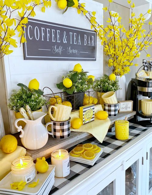 a coffee bar with lemons and tea cups