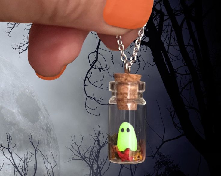 👻 Introducing our enchanting "Tiny Handcrafted Ghost in Bottle Necklace" - a bewitching accessory that captures the magic of the season!  🍂 Fall in love with this whimsical and delightful necklace that combines the charm of a miniature ghost with the beauty of autumn leaves. Handcrafted with love and attention to detail, this adorable glass bottle pendant is an absolute must-have for ghostly enthusiasts and nature lovers alike. 🌟Glow in the Dark Wonder: As the day turns to night, watch in won Ghost In Bottle, Dark Halloween Party, Ghost Bottle, Ghost In A Bottle, Pet Ghost, Tiny Ghost, Diy Ghost, Dark Ghost, Ghost Gifts