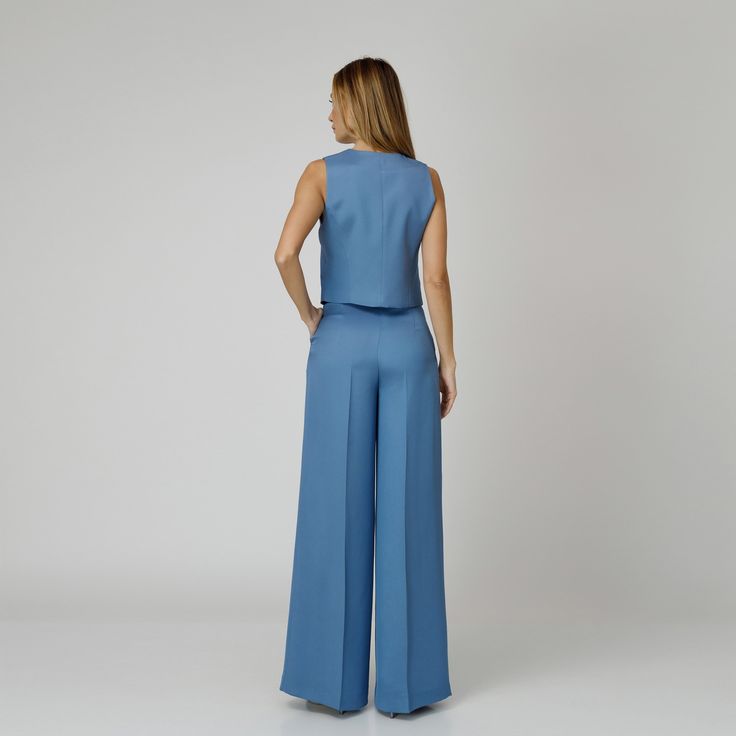 Introducing our Skye Silk Crepe Pants, a statement of luxurious comfort and timeless style. Tailored from  blue silk crepe with a wide-leg cut, they feature expertly placed darts that contour the waist and flatter the silhouette. The pressed crease detail offers a touch of refinement, elevating the overall look with understated polish. A concealed zipper and hook fastening in the front ensures a seamless finish, while the inclusion of pockets adds a practical yet chic element to the ensemble.  M Blue Skye, Crepe Pants, August Birthstone Jewelry, July Birthstone Jewelry, Gifts For New Mums, Pearl Jewellery Earrings, Jewelry Ring Box, Natural Silk, August Birth Stone