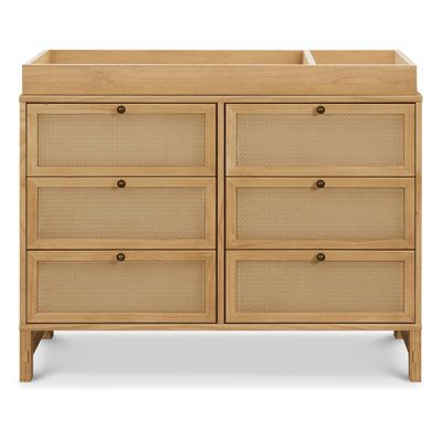 an image of a dresser with drawers on the front and bottom side, in natural wood