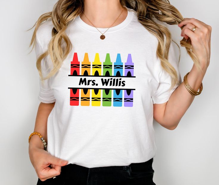 Elevate your teacher style with our charming Custom Crayon Teacher T-Shirt! This playful tee features a vibrant crayon motif that adds a touch of whimsy to your classroom attire. But here's the best part - it's fully customizable! Whether you want to display your name, school name, or team name, we'll personalize it just for you. Available in seven stunning colors, this shirt is perfect for showcasing your school spirit, and team pride, or simply adding a pop of color to your wardrobe. PRODUCT F Customizable Fun Multicolor T-shirt, Customizable T-shirt For Back To School Events, Personalized Short Sleeve T-shirt For Back To School, Personalized Casual Tops For Teacher Appreciation, Multicolor School Spirit T-shirt For School Events, Back To School Multicolor Fun T-shirt, Multicolor Fun T-shirt For Back To School, Fun Multicolor T-shirt For School Events, Fun Multicolor T-shirt For Back To School