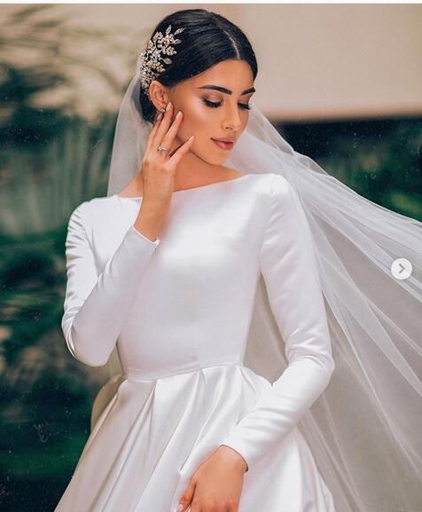 a woman wearing a white wedding dress and veil on her head, with the caption instagram com