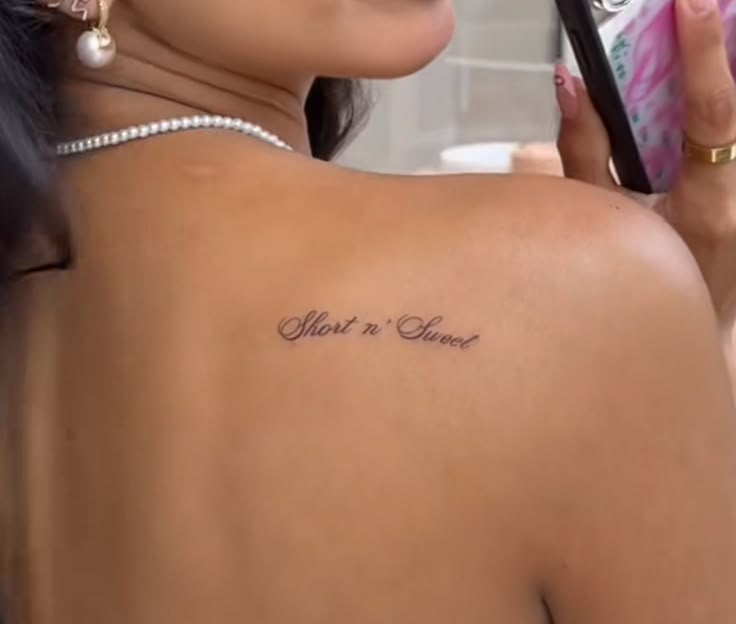 a woman with a small tattoo on her back