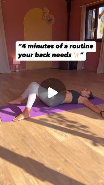 a woman is laying on her stomach in a yoga position with the words 4 minutes of a routine your back needs