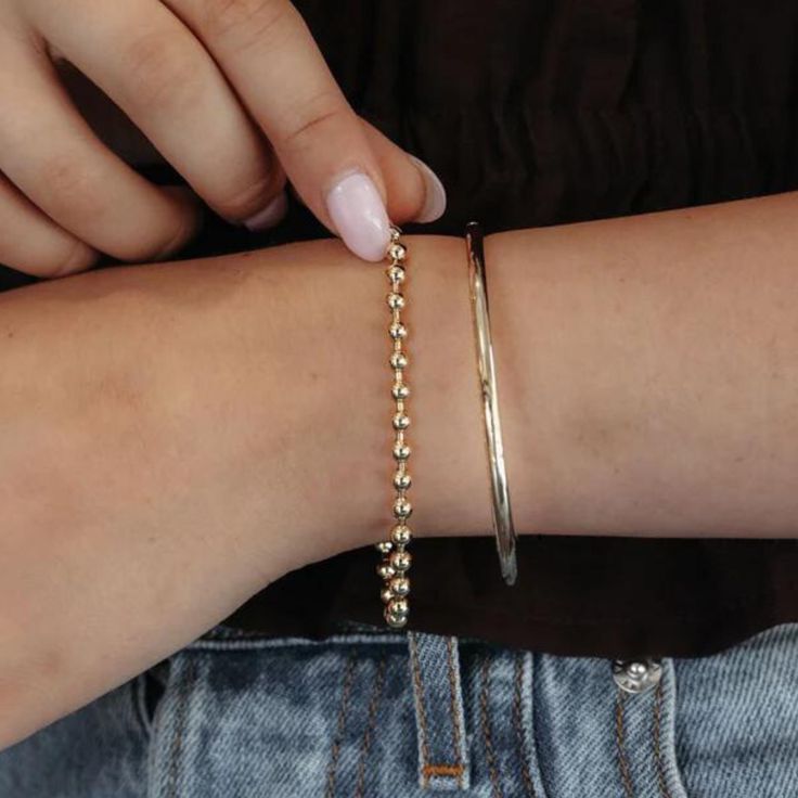 Level up your accessory game with the timeless look of this high polished 14K yellow gold Bead It Collection bracelet. It's a standout addition to your collection, perfect for wearing solo or mixing and matching with your current favorites! Wear with our matching earrings, necklace, and ring. 14K Yellow Gold Width: 4mm Length: 7 Inches Lobster Clasp Timeless Gold Jewelry With Round Beads, Elegant 14k Gold Bracelet With Gold Beads, Modern Gold Ball Chain Jewelry, Modern Hand-strung Jewelry For Everyday, Modern Hand-strung Everyday Jewelry, Classic 14k Gold Beaded Bracelets For Everyday, Everyday Beaded 14k Gold Bracelets, Elegant Beaded Bracelets With Polished Beads, Everyday Classic 14k Gold Beaded Bracelets