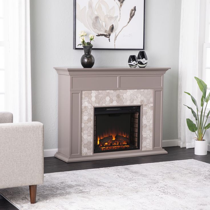 a living room with a couch and a fire place in the middle of the room