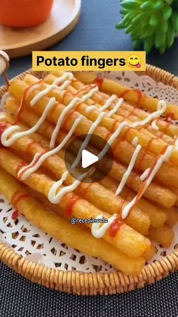 a plate topped with french fries covered in sauce