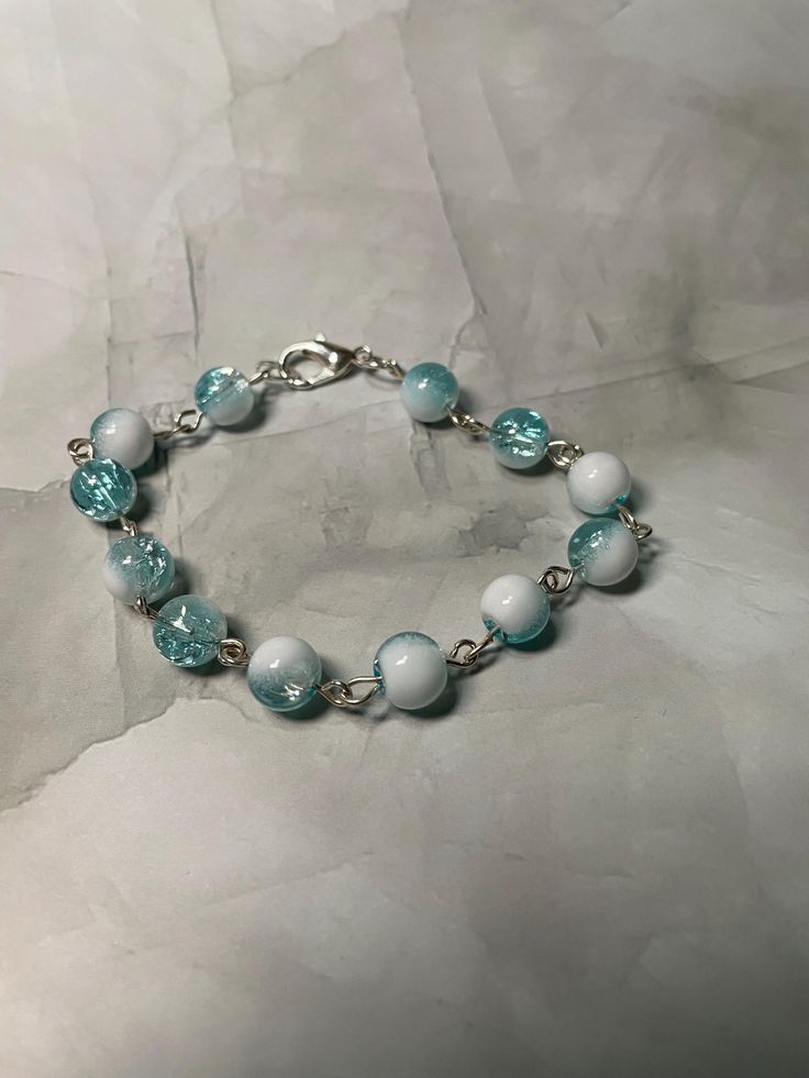 Beaded blue/white chain bracelet. Great for everyday use. 17 cm diameter. Blue And White Bracelet, Blue Bracelets, White Beaded Bracelet, White Bracelets, Blue Bracelet, Blue Beads, Bronx, Chain Bracelet, Beaded Bracelet