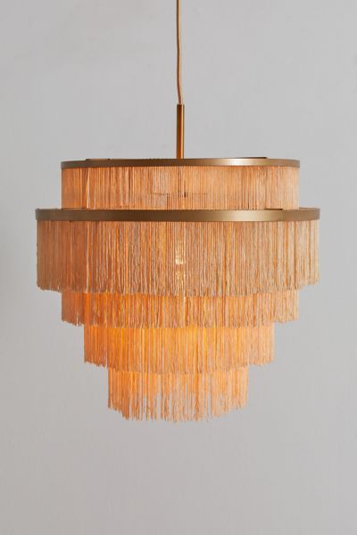 a chandelier with fringes hanging from the ceiling