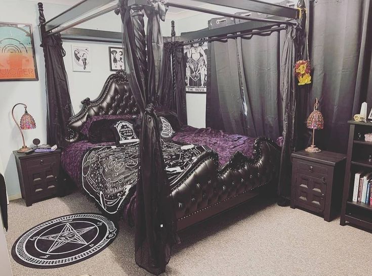 a bed room with a neatly made bed and black curtains