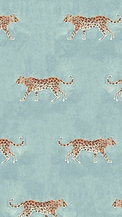 a pattern of cheetah walking across a blue background