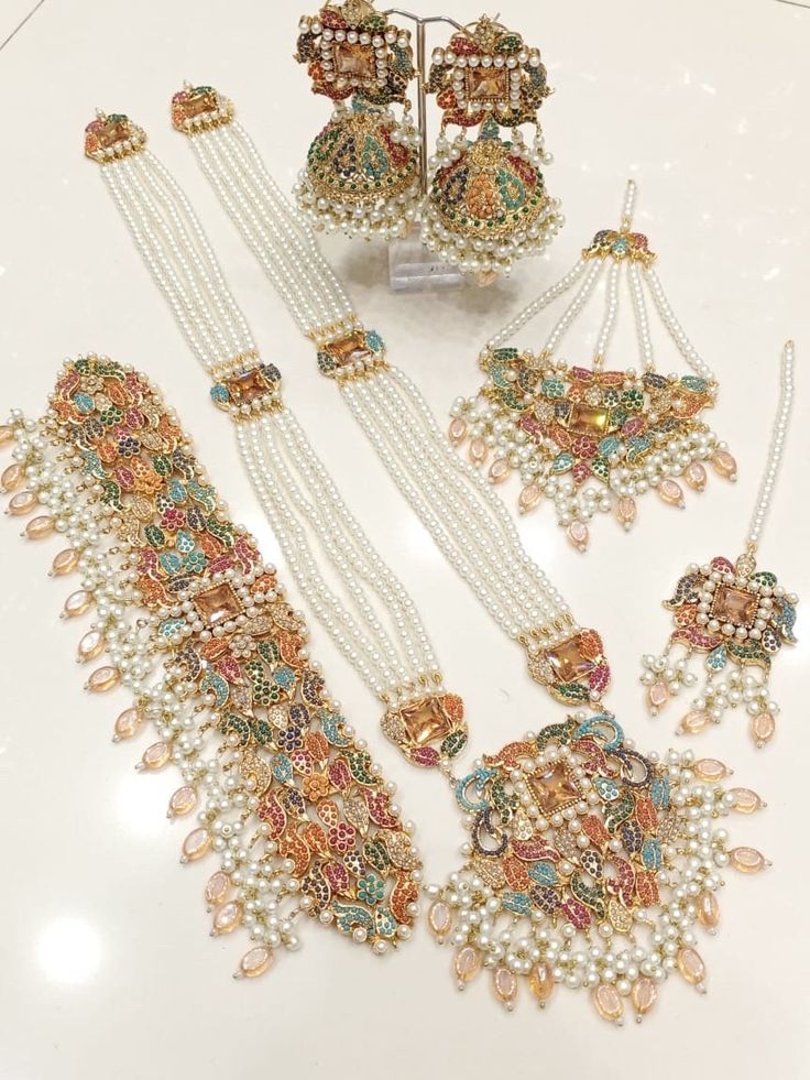 an assortment of necklaces and earrings on display