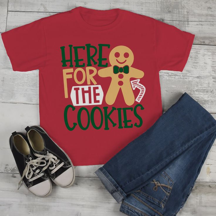 "Kids Christmas T Shirt Here For Cookies Xmas Shirts Cute Graphic Tee Cookie Shirts Outfit Boy's Girl's Toddler This graphic tee is perfect for Christmas! Let everyone know you came for the cookies. Grab the matching cookie baking or tasting crew from our shop and you'll have a whole team! This adorable design is available on several styles so you can outfit the whole family in matching Christmas shirts. Get in the holiday spirit and start your baking early this year! It would not be Christmas w Kids Christmas T Shirts, Cookie Shirt, Fun Fonts, Christmas Shirts For Kids, Matching Christmas Shirts, Shirts Outfit, Drawstring Gift Bag, Shirts Cute, Gingerbread Cookie