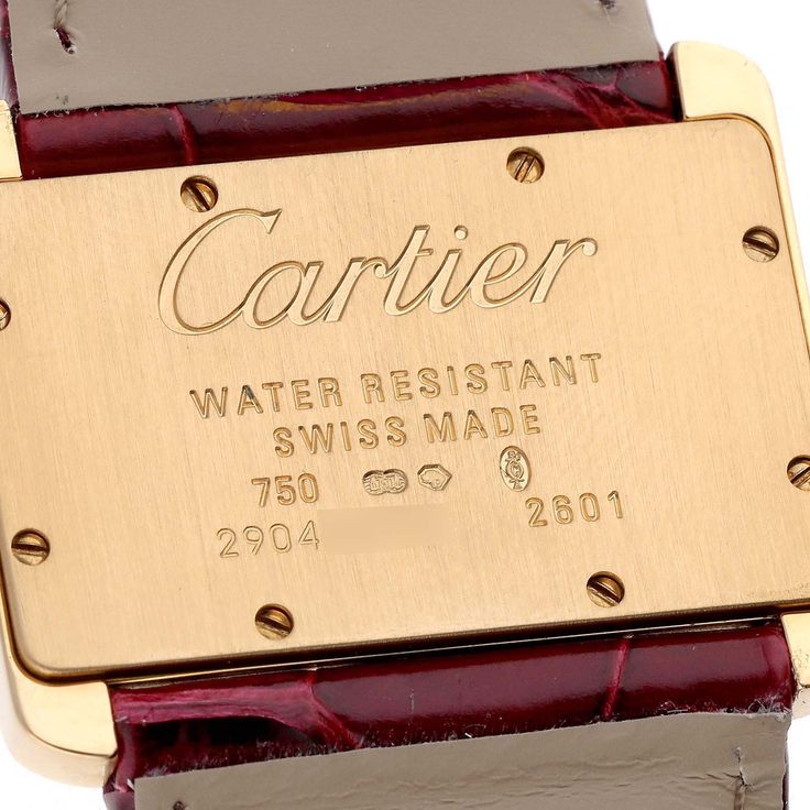 Cartier Tank Divan Mini Yellow Gold Red Strap Ladies Watch W6300356. Quartz movement. 18K yellow gold case 31.5 x 25.0 mm. Circular grained crown set with the blue faceted sapphire. 18K yellow gold fixed smooth bezel. Scratch resistant sapphire crystal. Silver dial. Painted black Roman numeral hour markers. Sword-shaped blue hands. Secret Cartier signature at X. Red leather strap with 18K yellow gold tang buckle. Vintage Cartier Gold Watch Accessories, Vintage Gold Cartier Watch Accessories, Anniversary Yellow Gold Watch Accessories With Diamond Hour Markers, Cartier Polished Finish Gold Watch Accessories, Modern Gold Cartier Watches, Luxury Engraved Yellow Gold Watches, Gold Rectangular Cartier Watch Accessories, Gold Rectangular Cartier Watch, Luxury Gold Cartier Watch Accessories