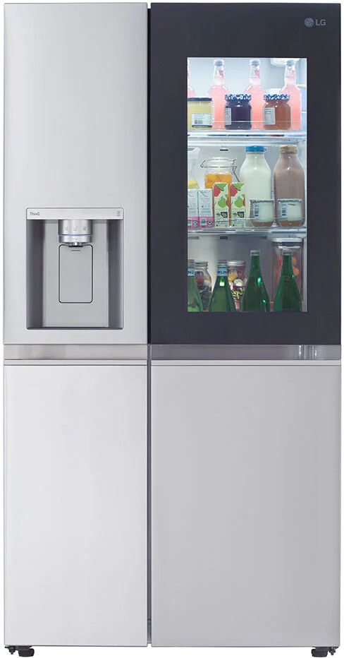 a silver refrigerator freezer sitting next to an icebox filled with drinks and beverages