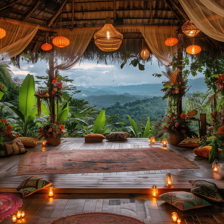 an outdoor area with candles lit up on the floor and lights hanging from the ceiling